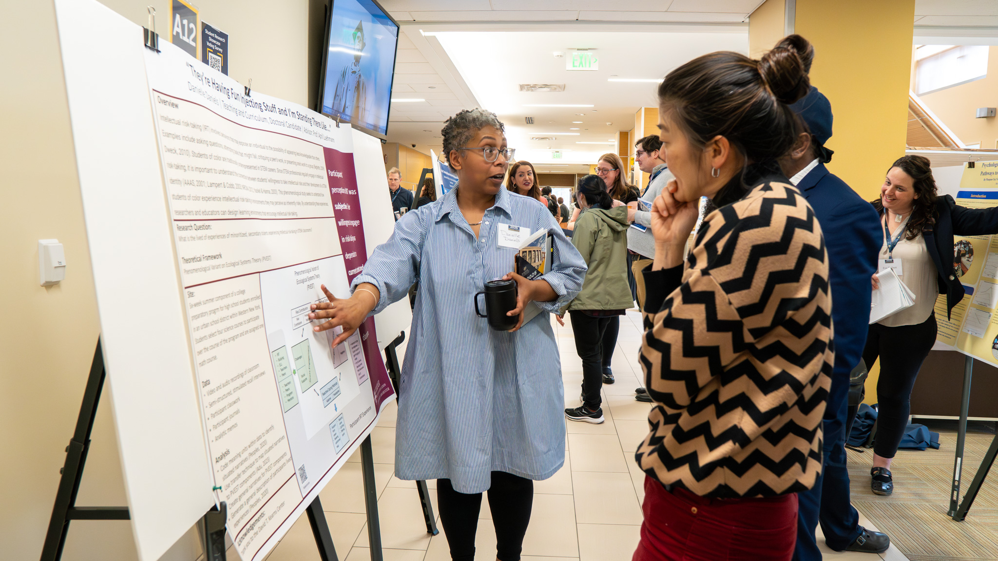 Warner student presenting her poster