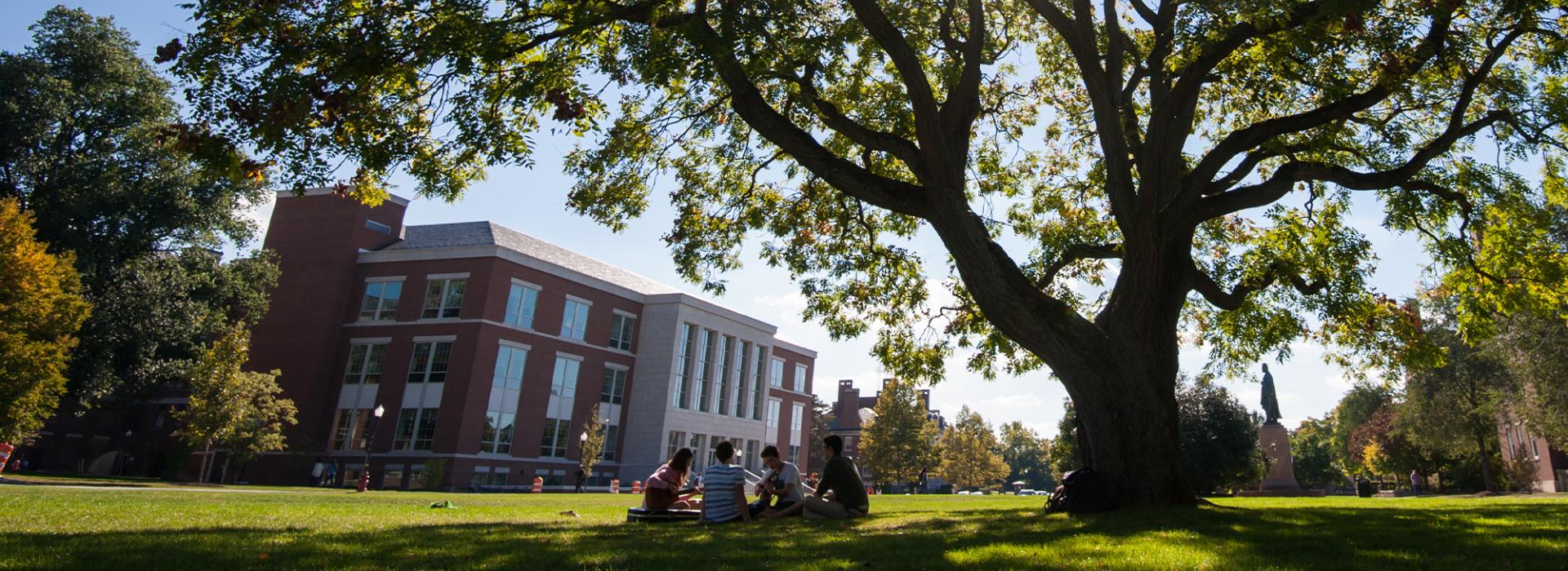 Students sitting on quad in front of LeChase Hall