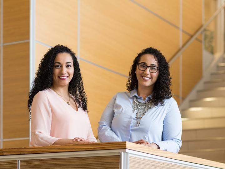 Egyptian-born sisters Yasmin (right) and Ayaa Elgoharry graduated with a master's in higher education leadership from the the Warner School